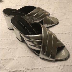 A super cute pair of Steven Madden silver mules